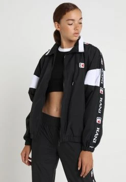 Großhandel ⭐ Karl Kani TAPE - Leichte Jacke - Black/white, Damen 🥰
