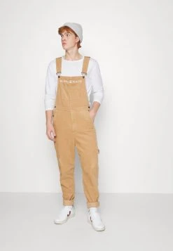 Beste Bewertungen von 🤩 Karl Kani RETRO DUNGAREE UNISEX - Stoffhose - Sand 👍 -Karl Kani Verkäufe 71500db0f2ec43dd81d60736fb7f1feb