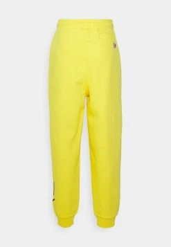 Coupon ✔️ Karl Kani UNISEX SIGNATURE REGULAR FIT - Jogginghose - Yellow ✔️ -Karl Kani Verkäufe 75c5b7622f2e4e43bf7bf6a345e672b0