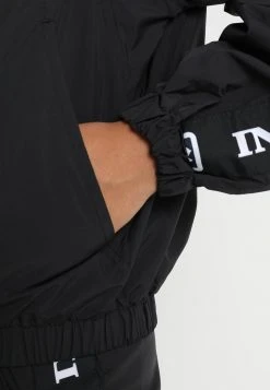 Großhandel ⭐ Karl Kani TAPE - Leichte Jacke - Black/white, Damen 🥰 -Karl Kani Verkäufe 91838d9adf4a443aaff2769e148ec3ba