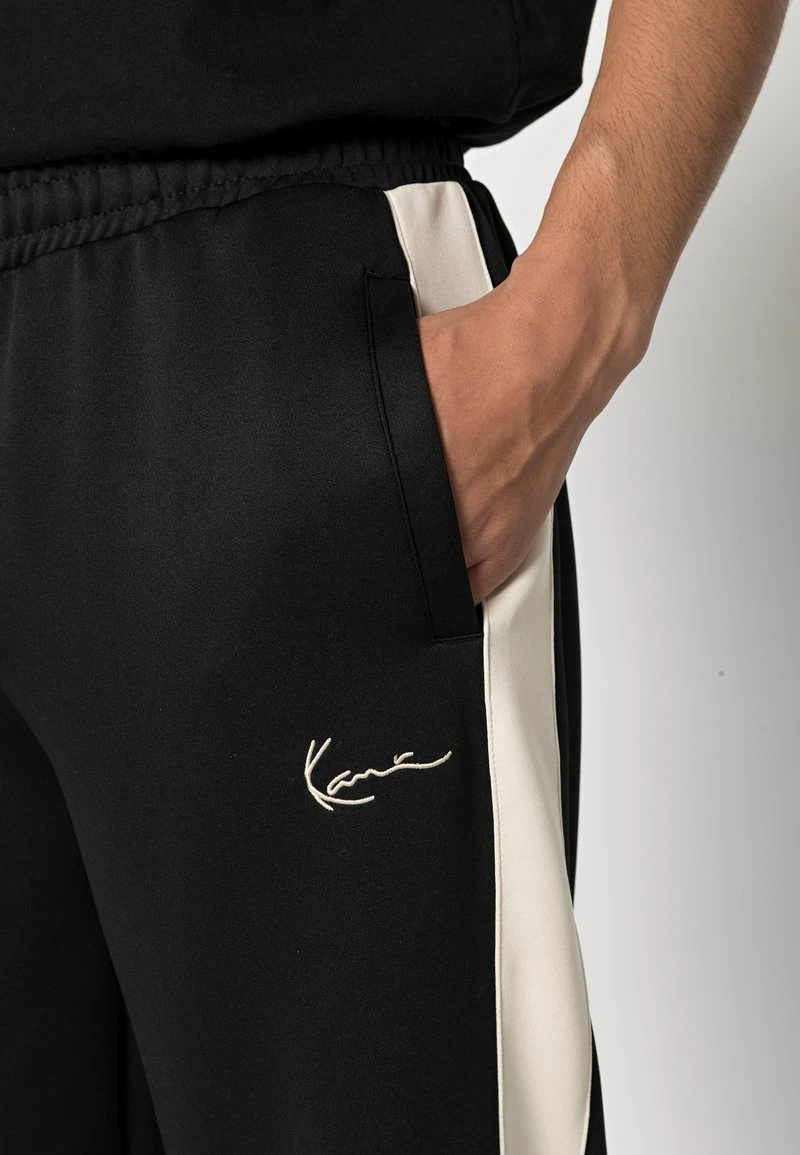 Am billigsten 🎁 Karl Kani SMALL SIGNATURE TRACKPANTS - Jogginghose - Black, Herren ⭐ 7 Am billigsten 🎁 Karl Kani SMALL SIGNATURE TRACKPANTS - Jogginghose - Black, Herren ⭐ – Bild 5
