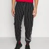 Am billigsten ⌛ Karl Kani SIGNATURE PINSTRIPE PANTS UNISEX - Jogginghose - Black 🤩 -Karl Kani Verkäufe d3722176a64444719bbe6dd0e95ffdcf