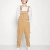Beste Bewertungen von 🤩 Karl Kani RETRO DUNGAREE UNISEX - Stoffhose - Sand 👍 -Karl Kani Verkäufe f68fcfdc67c543d98f93380af0cffa4e